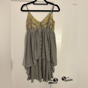 Pretty grey knit dress with yellow detail on bust and waterfall hem